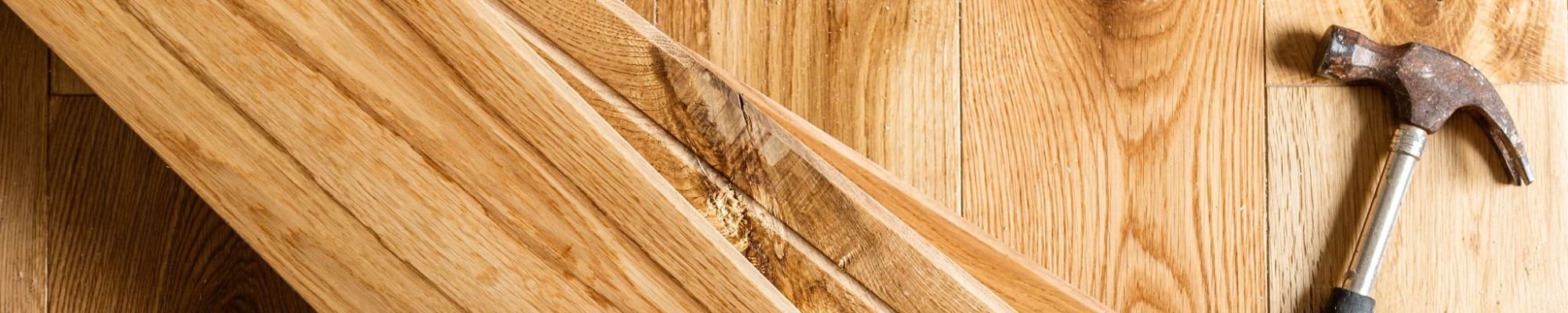 Planks with a hammer for Preston Thompson's Carpet Shoppe in Dickson, TN