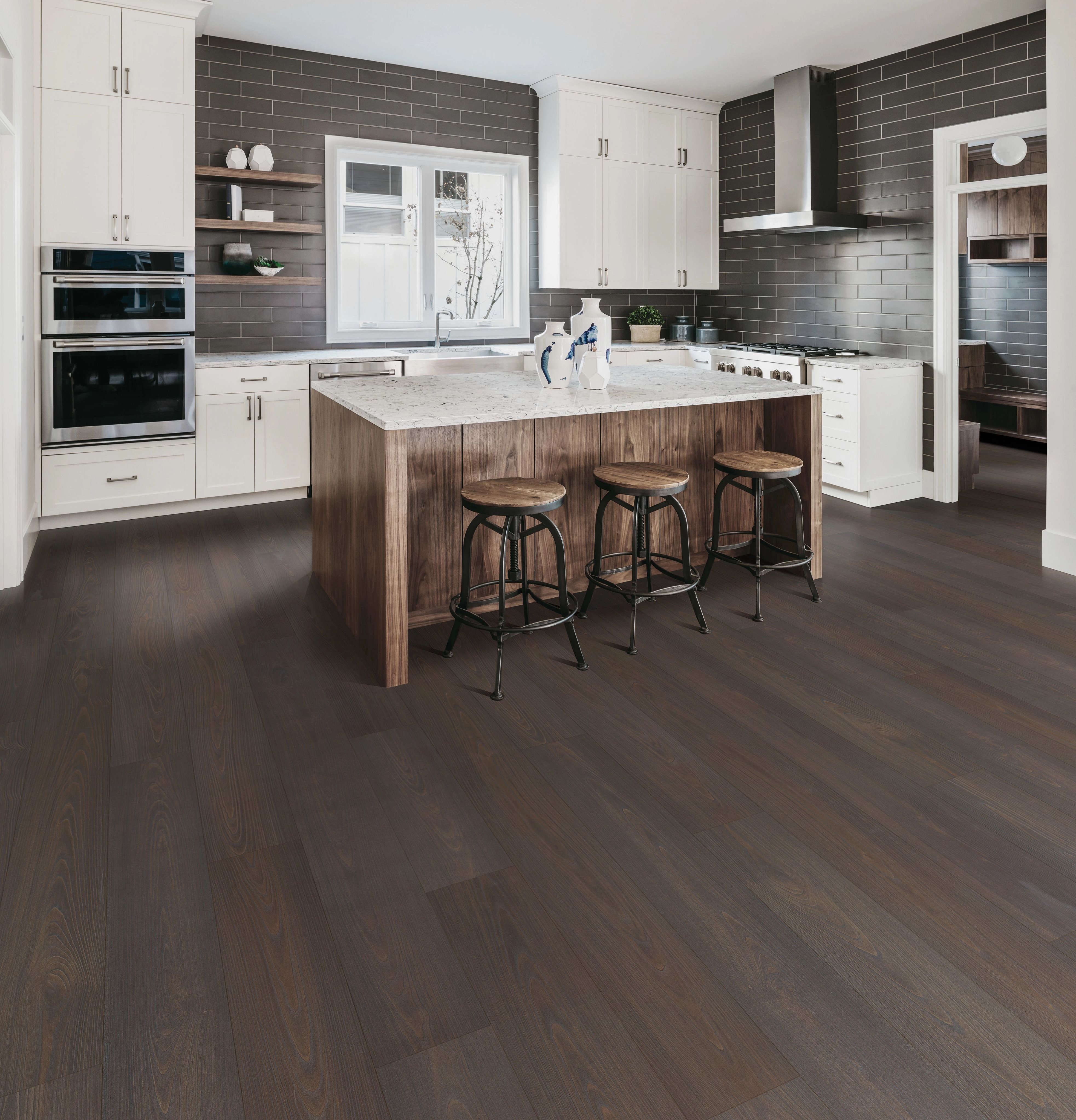 brown hardwood floor and white kitchen furniture in Dickson, TN area by Preston Thompson's Carpet Shoppe
